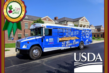 The Big Blue Bus with the USDA logo and Turnip The Beet award ribbon